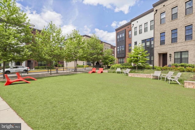 7458 Backett Wood Ter Unit 401, Mclean, VA 22102 - view of community featuring a lawn