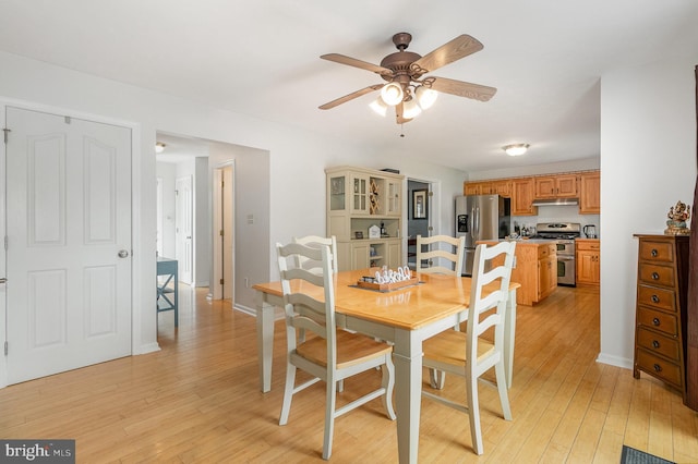 349 Lexington Way, Littlestown, PA 17340 - dining space featuring a ceiling fan, light wood-style flooring, and baseboards
