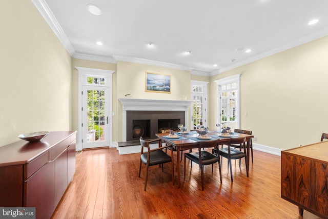 4491 Province Line Rd, Princeton, NJ 08540 - dining room featuring light wood-style floors, a fireplace with raised hearth, ornamental molding, recessed lighting, and baseboards