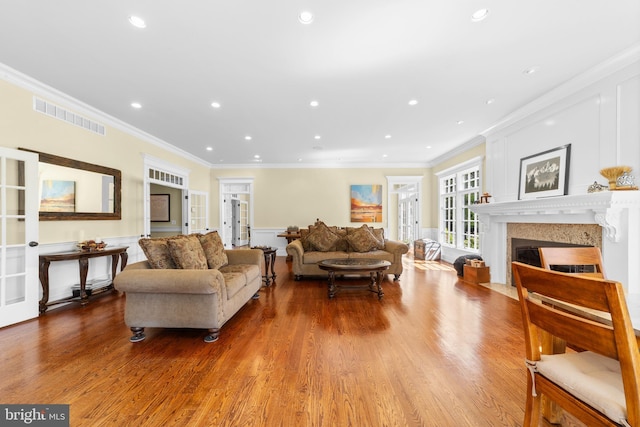 4491 Province Line Rd, Princeton, NJ 08540 - living area featuring ornamental molding, wood finished floors, a fireplace with flush hearth, wainscoting, and a decorative wall