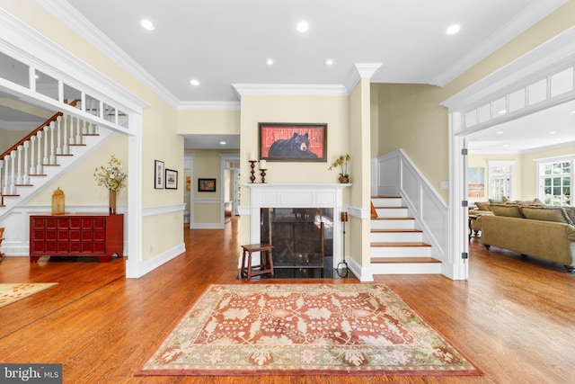 4491 Province Line Rd, Princeton, NJ 08540 - living area featuring stairway, wood finished floors, a fireplace with flush hearth, crown molding, and recessed lighting