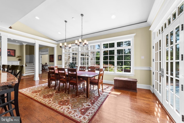 4491 Province Line Rd, Princeton, NJ 08540 - dining area with ornamental molding, ornate columns, wood finished floors, vaulted ceiling, and a chandelier