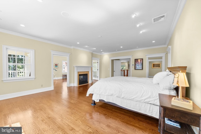 4491 Province Line Rd, Princeton, NJ 08540 - bedroom featuring multiple windows, ornamental molding, a glass covered fireplace, wood finished floors, and recessed lighting