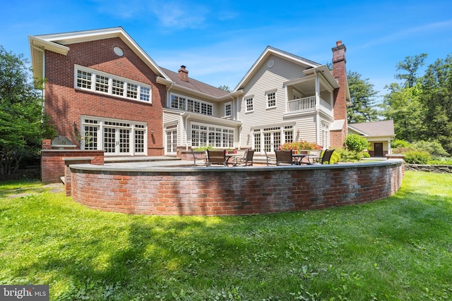 4491 Province Line Rd, Princeton, NJ 08540 - back of property with french doors, a chimney, a lawn, area for grilling, and a patio