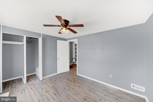 7952 Eastdale Rd, Baltimore, MD 21224 - unfurnished bedroom with baseboards, wood finished floors, a closet, and ceiling fan