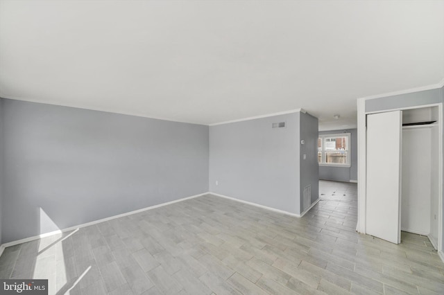 7952 Eastdale Rd, Baltimore, MD 21224 - unfurnished room with ornamental molding, light wood finished floors, and baseboards