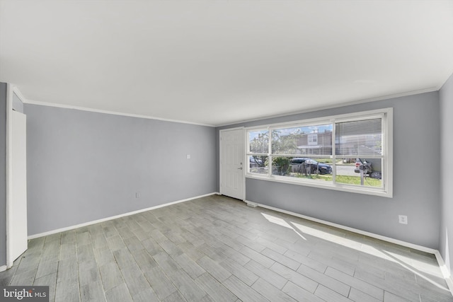 7952 Eastdale Rd, Baltimore, MD 21224 - unfurnished room with crown molding, baseboards, and wood finished floors
