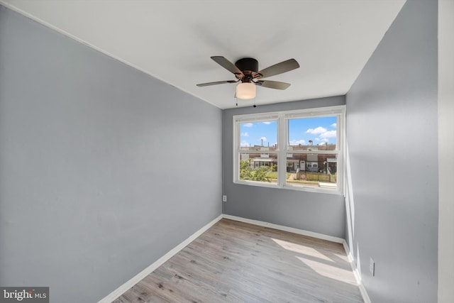 7952 Eastdale Rd, Baltimore, MD 21224 - empty room with a ceiling fan, baseboards, and light wood-style floors