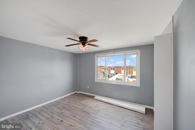 7952 Eastdale Rd, Baltimore, MD 21224 - unfurnished room with wood finished floors, a ceiling fan, and baseboards