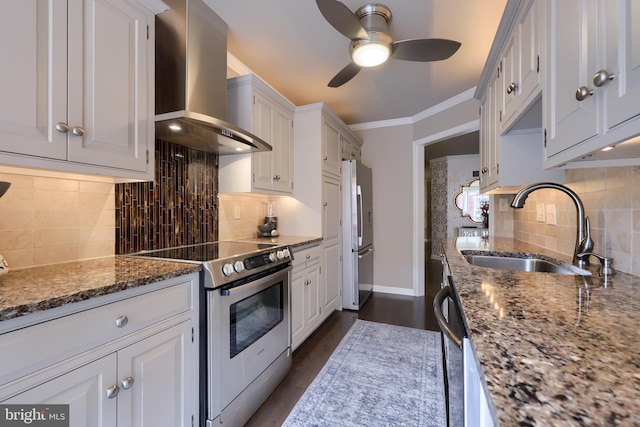 110 N Duke St Unit 201, Lancaster, PA 17602 - kitchen with wall chimney range hood, appliances with stainless steel finishes, a sink, ceiling fan, and baseboards