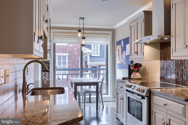110 N Duke St Unit 201, Lancaster, PA 17602 - kitchen featuring stainless steel range with electric cooktop, wall chimney range hood, a sink, healthy amount of natural light, and crown molding