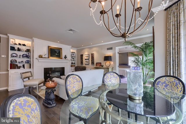 110 N Duke St Unit 201, Lancaster, PA 17602 - dining space featuring crown molding, a glass covered fireplace, dark wood-style flooring, recessed lighting, and a chandelier