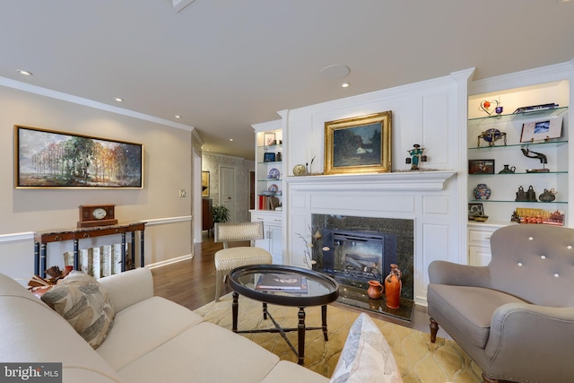 110 N Duke St Unit 201, Lancaster, PA 17602 - living area with ornamental molding, a fireplace, light wood-type flooring, recessed lighting, and built in features