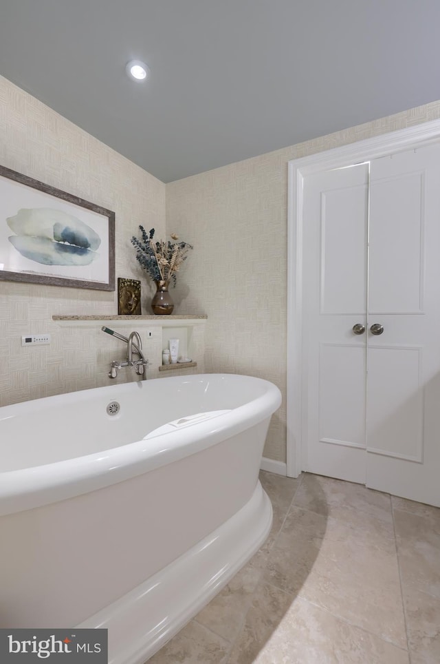 110 N Duke St Unit 201, Lancaster, PA 17602 - bathroom featuring a freestanding tub and tile patterned floors