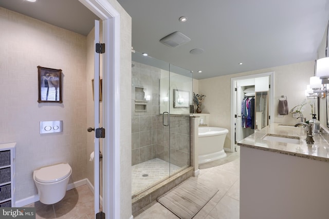 110 N Duke St Unit 201, Lancaster, PA 17602 - bathroom featuring double vanity, a stall shower, a freestanding bath, toilet, and baseboards