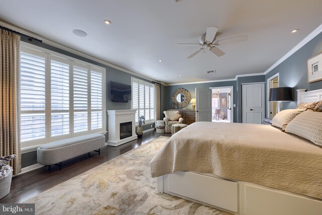 110 N Duke St Unit 201, Lancaster, PA 17602 - bedroom featuring crown molding, wood finished floors, a glass covered fireplace, and a ceiling fan