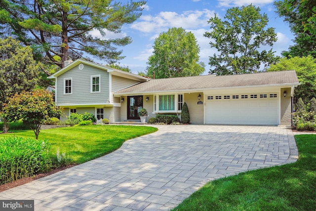9505 Spinet Ct, Vienna, VA 22182 - tri-level home with a garage, decorative driveway, and a front yard