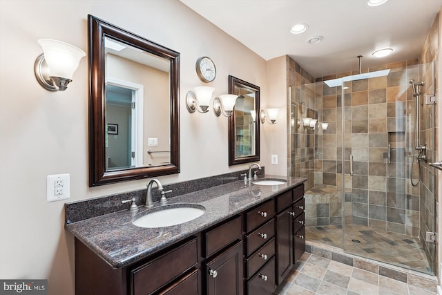 9505 Spinet Ct, Vienna, VA 22182 - bathroom featuring a stall shower, double vanity, and recessed lighting