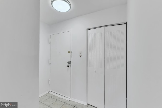 523 N Armistead St Unit 102, Alexandria, VA 22312 - entryway with light tile patterned floors and baseboards