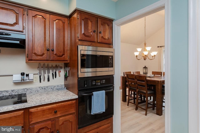 1492 Cumberland Dr, Rockingham, VA 22801 - kitchen featuring black appliances, light wood finished floors, a chandelier, vaulted ceiling, and brown cabinets