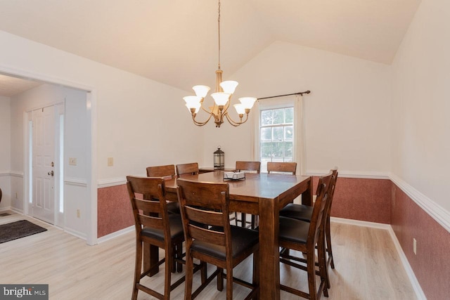 1492 Cumberland Dr, Rockingham, VA 22801 - dining room with light wood-style flooring, a wainscoted wall, vaulted ceiling, a chandelier, and baseboards