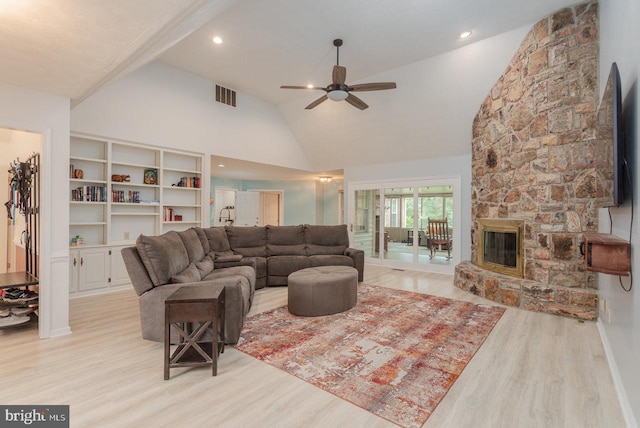 1492 Cumberland Dr, Rockingham, VA 22801 - living room with light wood-style flooring, ceiling fan, high vaulted ceiling, and a stone fireplace