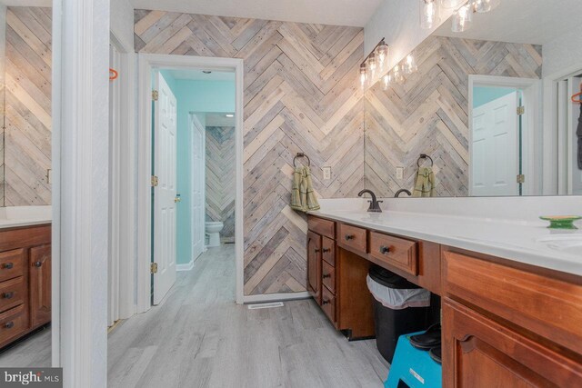 1492 Cumberland Dr, Rockingham, VA 22801 - full bath featuring vanity, a chandelier, wood finished floors, and toilet