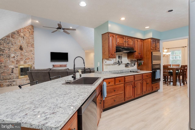 1492 Cumberland Dr, Rockingham, VA 22801 - kitchen with black appliances, a sink, under cabinet range hood, light wood-style flooring, and ceiling fan