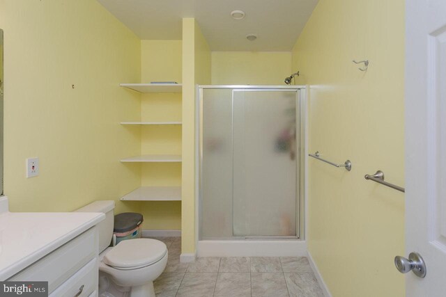 1492 Cumberland Dr, Rockingham, VA 22801 - full bathroom featuring a shower stall, vanity, toilet, and baseboards