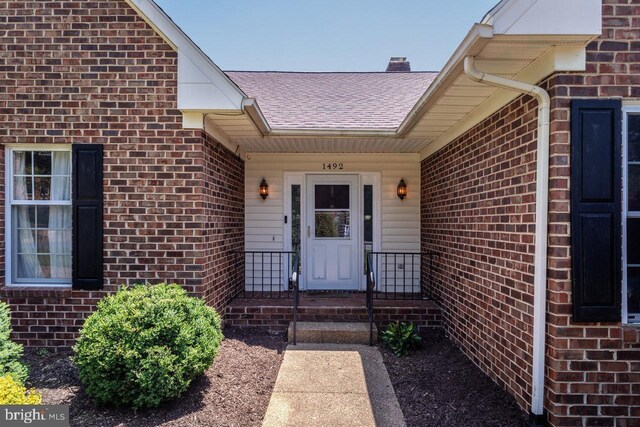 1492 Cumberland Dr, Rockingham, VA 22801 - property entrance with brick siding and a shingled roof