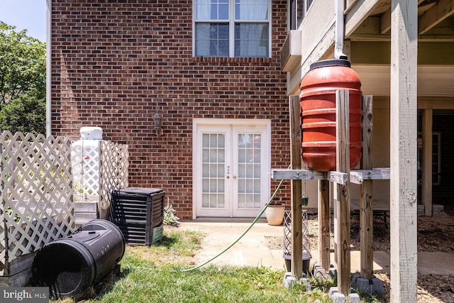 1492 Cumberland Dr, Rockingham, VA 22801 - view of exterior entry featuring brick siding, french doors, and a patio area