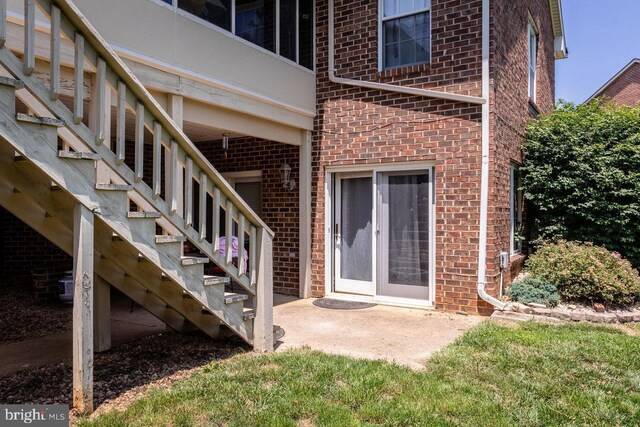 1492 Cumberland Dr, Rockingham, VA 22801 - property entrance featuring brick siding and a patio