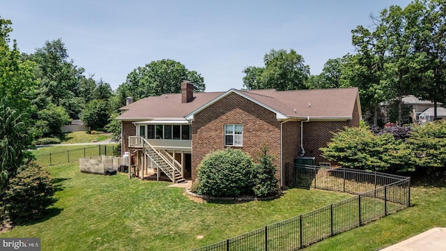 1492 Cumberland Dr, Rockingham, VA 22801 - rear view of property with brick siding, a sunroom, stairway, and a chimney