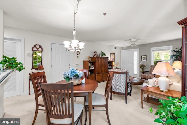 9718 Winery Ct Unit 9718, Gaithersburg, MD 20879 - dining space featuring light carpet, a chandelier, and a ceiling fan