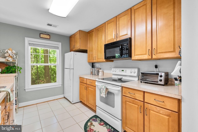 9718 Winery Ct Unit 9718, Gaithersburg, MD 20879 - kitchen featuring white appliances, light countertops, baseboards, and light tile patterned floors