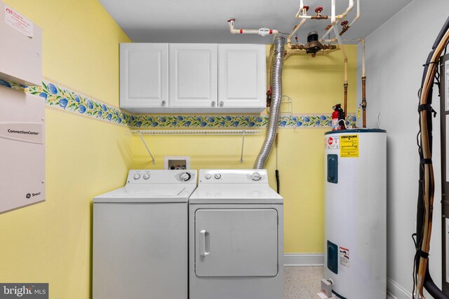 9718 Winery Ct Unit 9718, Gaithersburg, MD 20879 - laundry room featuring washing machine and clothes dryer, water heater, cabinet space, and baseboards