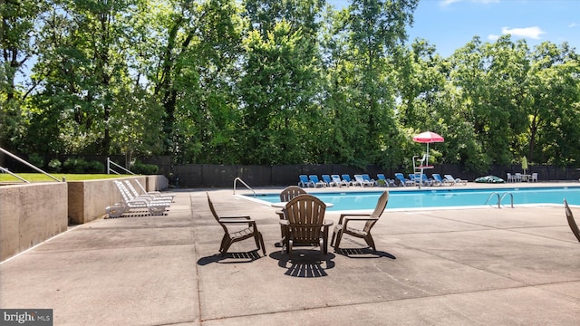 7333 New Hampshire Ave Unit 800, Takoma Park, MD 20912 - community pool featuring a patio area and view of scattered trees