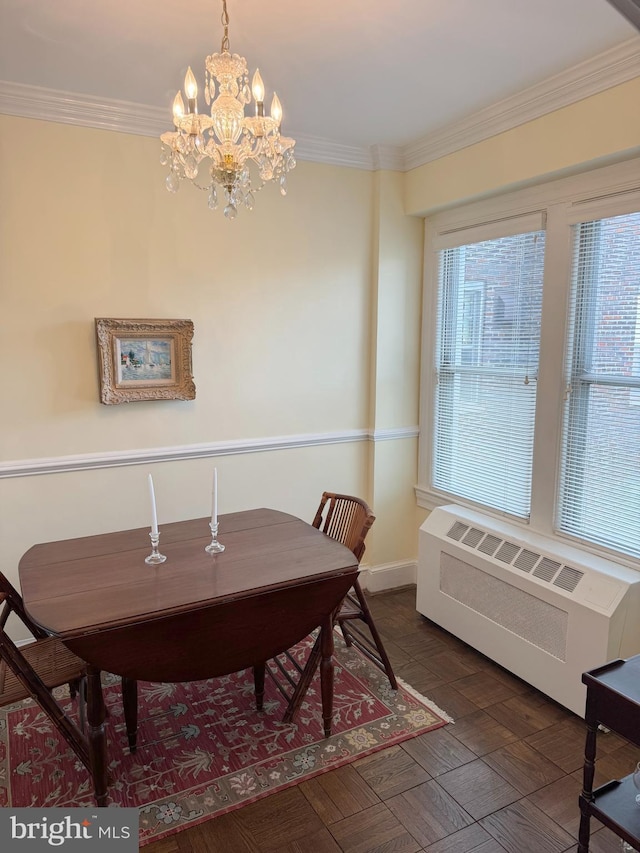 4000 Cathedral Ave NW Unit 406B, Washington, DC 20016 - dining room with radiator heating unit, a chandelier, and ornamental molding