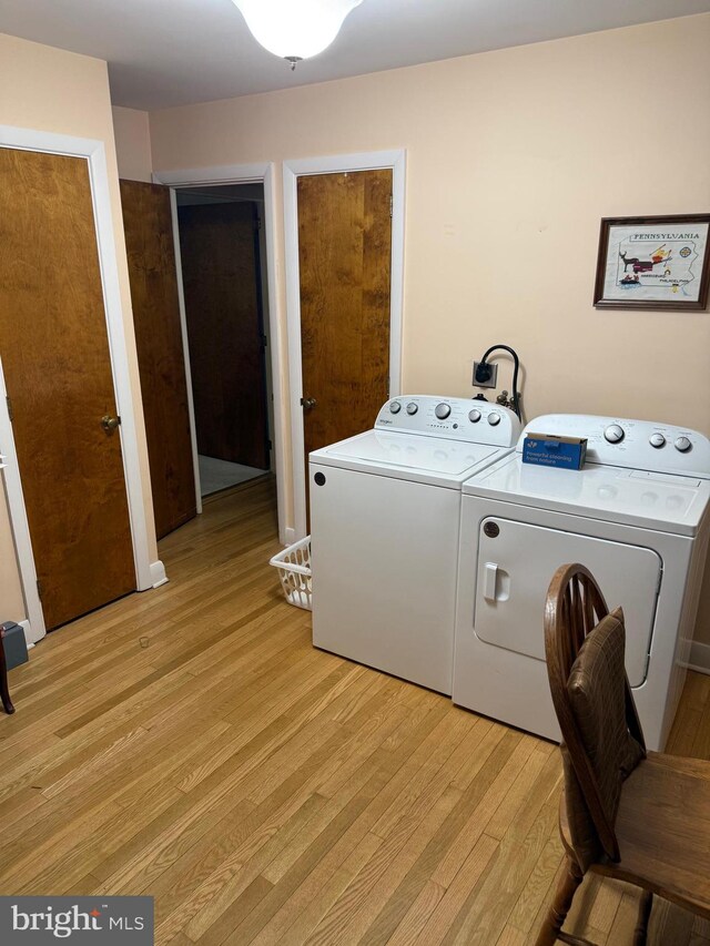 228 S Forge Rd, Palmyra, PA 17078 - laundry area with light wood-type flooring and separate washer and dryer