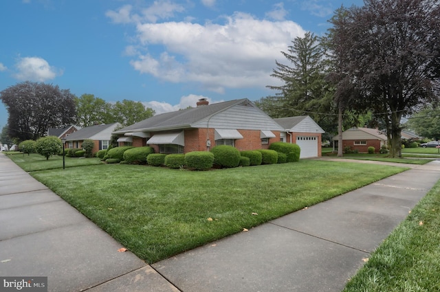 228 S Forge Rd, Palmyra, PA 17078 - view of property exterior with a yard, a chimney, and driveway