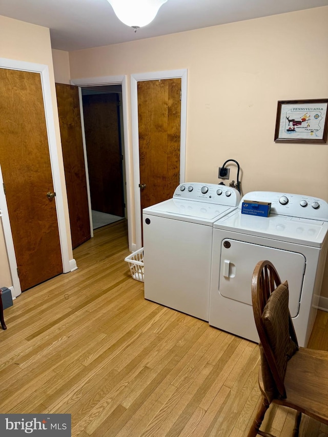 228 S Forge Rd, Palmyra, PA 17078 - washroom with light wood finished floors and independent washer and dryer