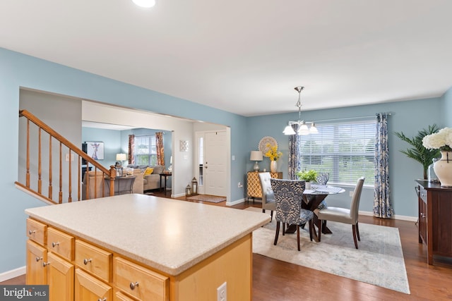 1900 Preserve Ln, Palmyra, PA 17078 - kitchen with light brown cabinetry, dark wood-style floors, a chandelier, a center island, and light countertops