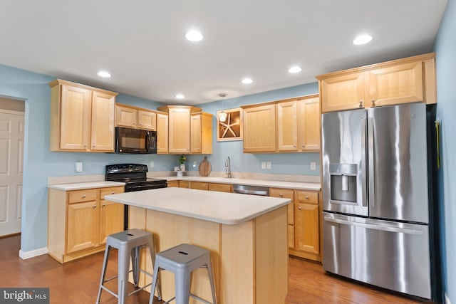 1900 Preserve Ln, Palmyra, PA 17078 - kitchen with black appliances, light brown cabinets, light countertops, dark wood-style floors, and recessed lighting