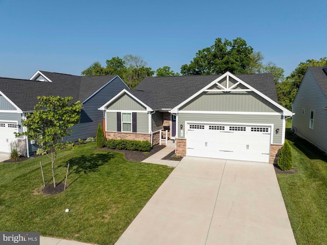 189 Massie St, Stephens City, VA 22655 - craftsman house featuring a garage, board and batten siding, stone siding, and a front yard