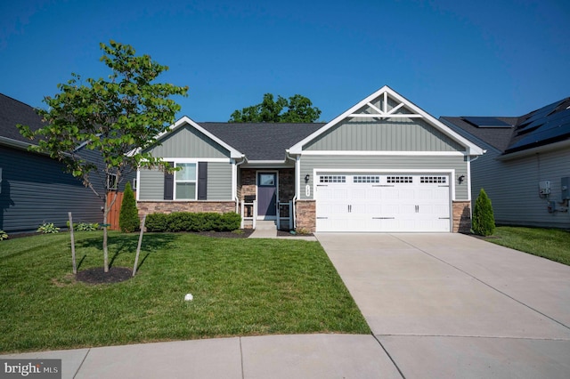 189 Massie St, Stephens City, VA 22655 - craftsman house featuring stone siding, board and batten siding, a garage, a front yard, and driveway