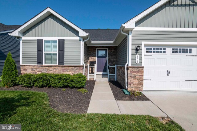 189 Massie St, Stephens City, VA 22655 - view of front of home featuring board and batten siding, stone siding, and an attached garage