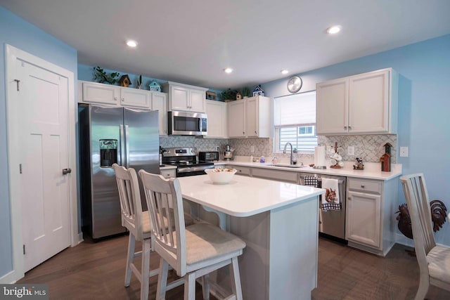 189 Massie St, Stephens City, VA 22655 - kitchen with stainless steel appliances, a sink, backsplash, white cabinetry, and recessed lighting