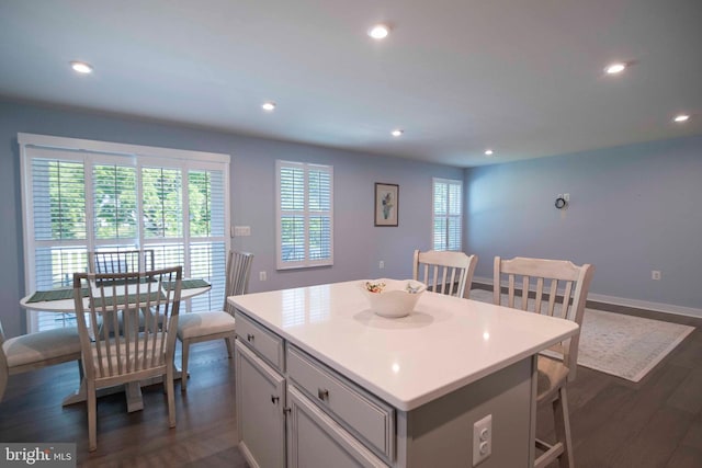 189 Massie St, Stephens City, VA 22655 - kitchen featuring dark wood-style floors, a center island, recessed lighting, light countertops, and a kitchen bar