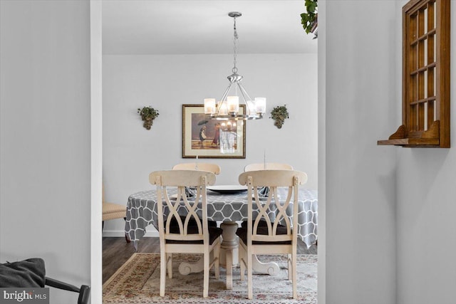 228 Cranberry Dr, Blakeslee, PA 18610 - dining room with a chandelier, wood finished floors, and baseboards