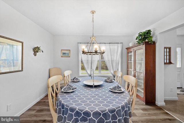 228 Cranberry Dr, Blakeslee, PA 18610 - dining room with a chandelier, healthy amount of natural light, baseboards, and wood finished floors